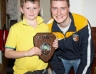 Calum Scullion collects the Under 10 Division 2 Championship plaque from CJ Mc Gourty
